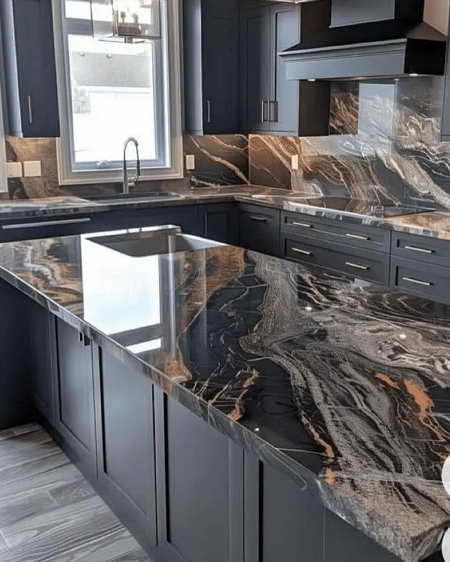 Deep navy shaker kitchen with custom range hood and continuous black, copper, and white exotic stone slab running from island countertop through full-height backsplash in Brooklyn Heights, New York City — JMR Construction